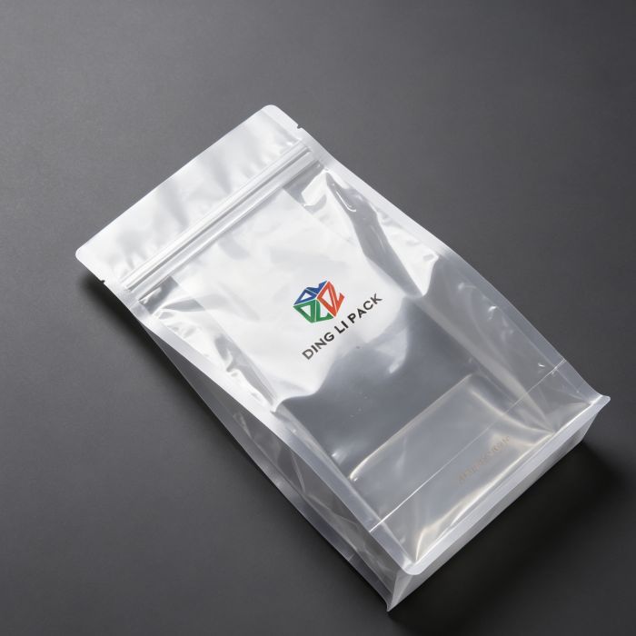 Flat bottom pouch base reinforcement